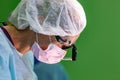 Female surgeon doctor wearing protective mask and hat during the operation. Healthcare, medical education, emergency Royalty Free Stock Photo