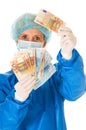 Female surgeon holding banknotes