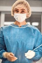 Female surgeon holding cannulas for collecting fat. separation of fat before transplantation. Plastic surgery, body fat Royalty Free Stock Photo