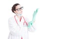 Female surgeon putting gloves on Royalty Free Stock Photo