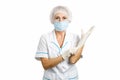 Female surgeon putting on gloves. Royalty Free Stock Photo