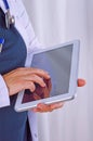 Doctor or surgeon using digital tablet