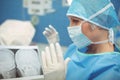 Female surgeon wearing surgical mask in operation theater Royalty Free Stock Photo