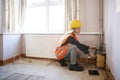 Female Surveyor In Hard Hat And High Visibility Jacket Checking Gas Supply