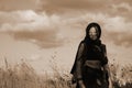 A female survivor in a post apocalyptic desert wasteland Royalty Free Stock Photo