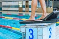 Female swimmer body in swimming start position and diving off Royalty Free Stock Photo