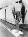 Female swimmer at edge of pool Royalty Free Stock Photo