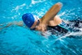 Female swimmer in an indoor swimming pool Royalty Free Stock Photo