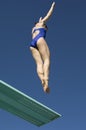 Female Swimmer Jumping On Diving Board Royalty Free Stock Photo