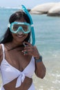 Female Swimmer Smiling And Putting On Snorkeling Goggles