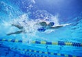 Female swimmer in United States swimsuit while swimming in pool Royalty Free Stock Photo