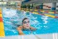 Female swimmer using freestyle technique in pool lane Royalty Free Stock Photo