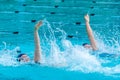 Female swimmers swimming back stroke Royalty Free Stock Photo