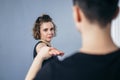 Female taekwondo instructor conducts personal training session for young woman at gym. Girl mastering new taekwondo moves during Royalty Free Stock Photo