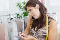 female tailor using mobile phone Royalty Free Stock Photo