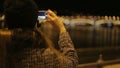 Female take picture of lighting river Dunai from embankment