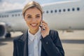 Female talking on the phone before the takeoff Royalty Free Stock Photo