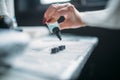 Female tattooist hands holds tattoo machine Royalty Free Stock Photo