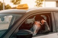 Female taxi driver with protective face mask and plastic visor Royalty Free Stock Photo