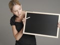 Female Teacher With Blackboard And Chalk