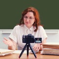 A female teacher conducts an online lesson in a school classroom. Learning at school via video, lifestyle