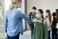 Teacher elbow greets students during a pandemic