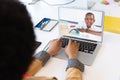 Female teacher having a video call with male student on laptop at home Royalty Free Stock Photo