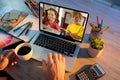 Female teacher having a video conference with male and female student on laptop at home Royalty Free Stock Photo