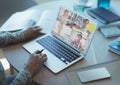 Female teacher having a video conference with multiple students on laptop at home Royalty Free Stock Photo