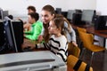 Female teacher helping teen schoolgirl studying in computer lab Royalty Free Stock Photo