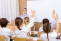 Female teacher with her pupils in the classroom