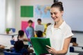 Female teacher looking at files Royalty Free Stock Photo