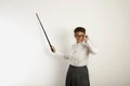 Female teacher with a pointer at white board