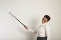 Female teacher with a pointer at white board Royalty Free Stock Photo