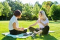 Female teacher psychologist social worker talking to teenage student on the lawn Royalty Free Stock Photo