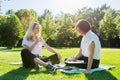 Female teacher psychologist social worker talking to teenage student on the lawn Royalty Free Stock Photo