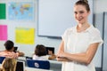 Female teacher standing with arms crosse Royalty Free Stock Photo