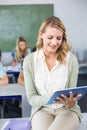 Female teacher using digital tablet in class Royalty Free Stock Photo