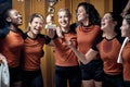 A female team posing and celebrating the won trophy. Female team sport Royalty Free Stock Photo