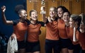 A female team posing for a photo with the won trophy. Female team sport Royalty Free Stock Photo