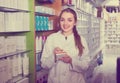 Female technician in chemist shop Royalty Free Stock Photo