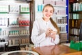 Female technician in chemist shop. Royalty Free Stock Photo