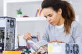 Female technician with dismantled computer and instruction book Royalty Free Stock Photo