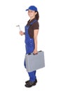 Female technician holding toolkit