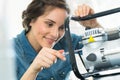 Female technician repairing machine Royalty Free Stock Photo