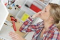 female technician servicing boiler using computer Royalty Free Stock Photo