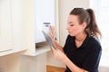 Female technician servicing boilerÃÂ using tablet computer Royalty Free Stock Photo