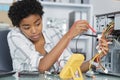 female technician during voltage measurement in computer cables Royalty Free Stock Photo