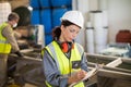 Female technician writing on clipboard Royalty Free Stock Photo