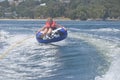 Female teen girl tubing on the river Royalty Free Stock Photo